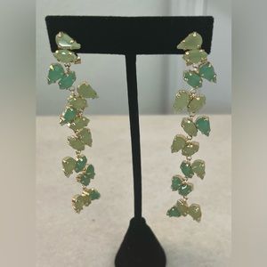 Long dangling gold plated earrings.